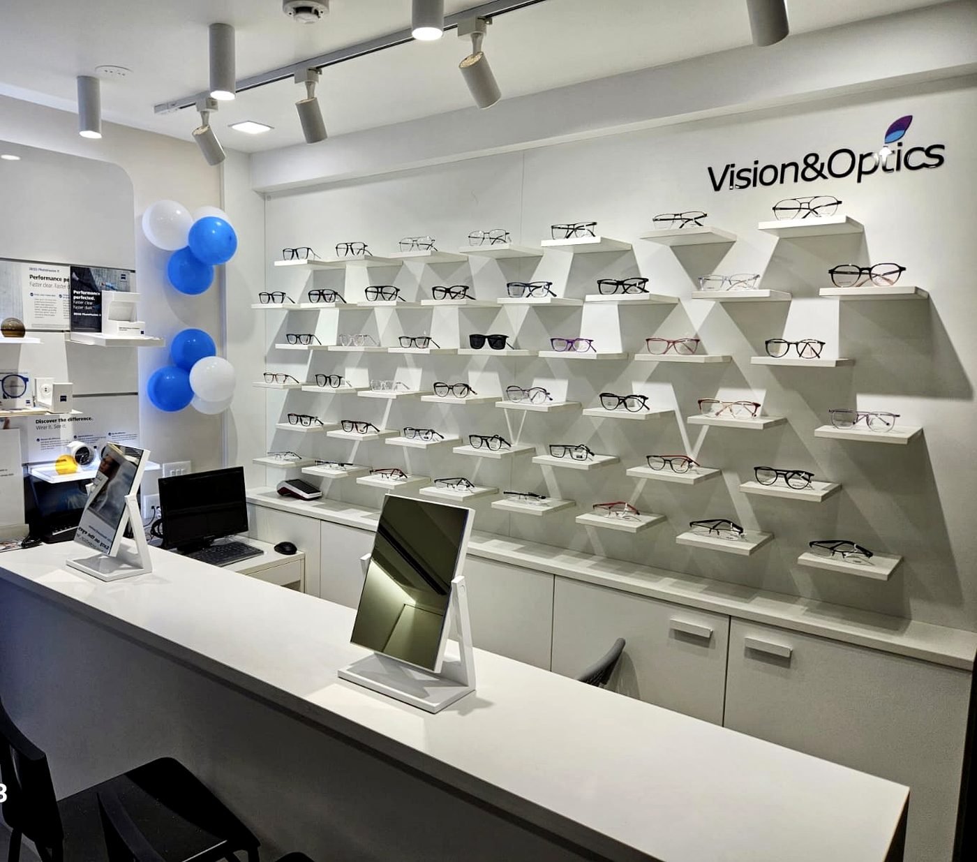 The frame display wall inside the Vision & Optics outlet at Bhaskar Colony, Thane West — a Premium ZEISS Store