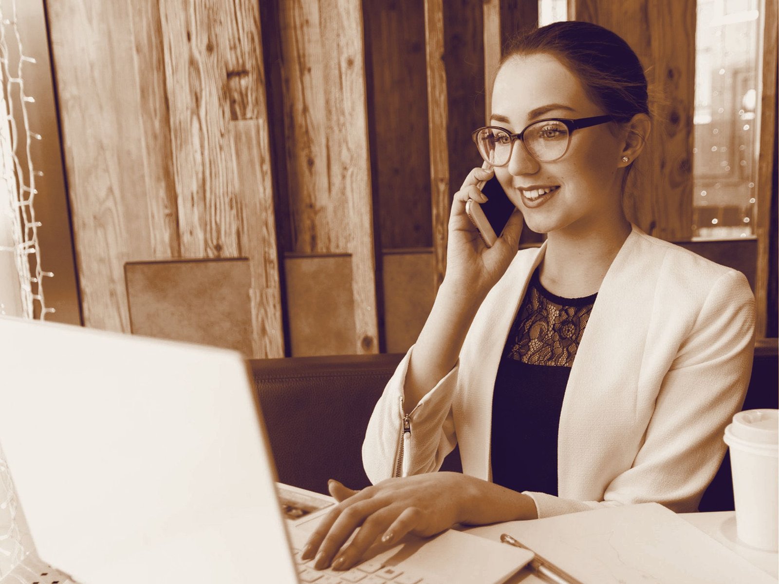 Woman wearing computer glasses at a laptop — progressive and office lenses from Vision & Optics, Thane